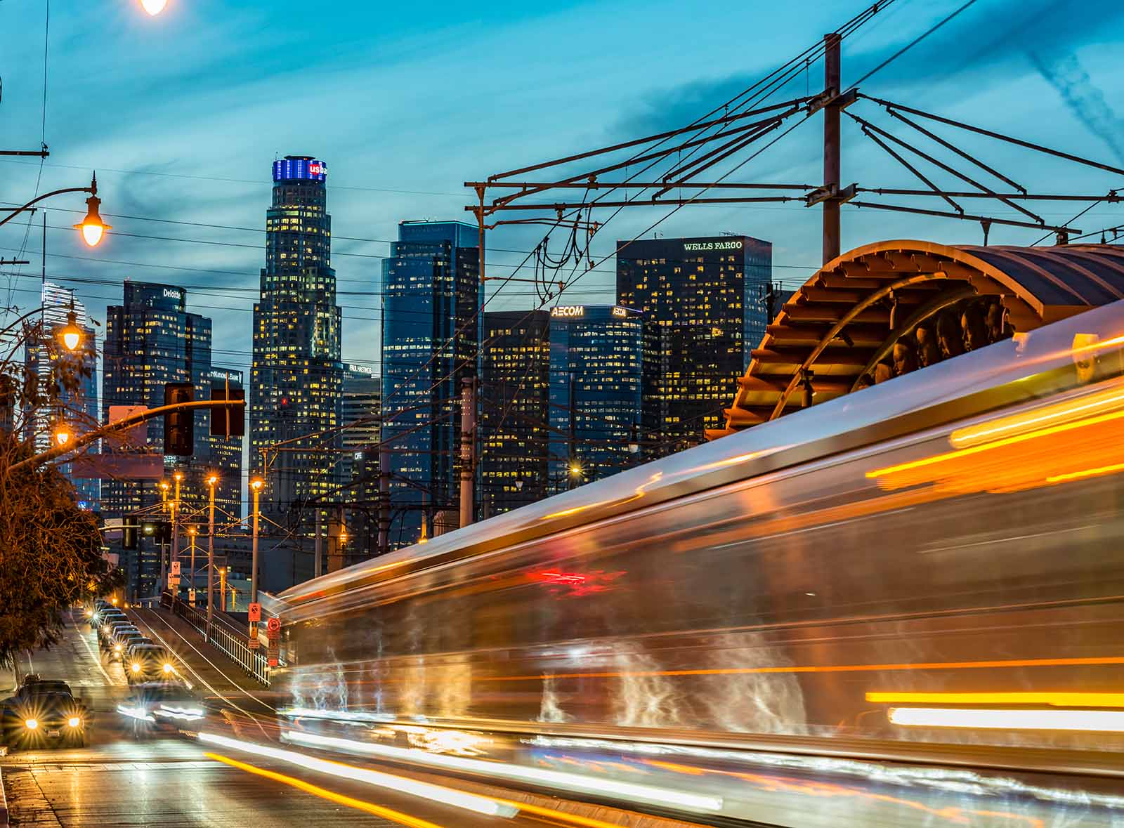 Photograph of LA traffic, with blurred train zooming by.
